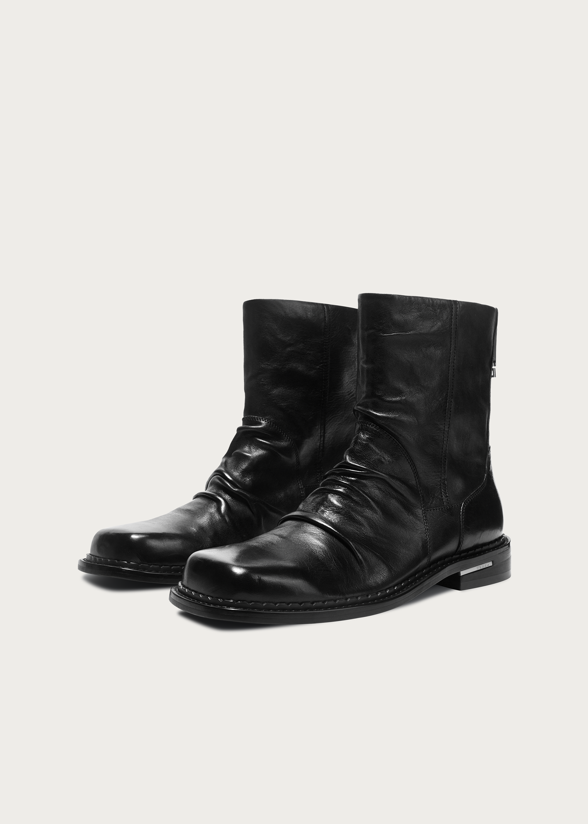 Square-toe washed horsehide boots on foot
