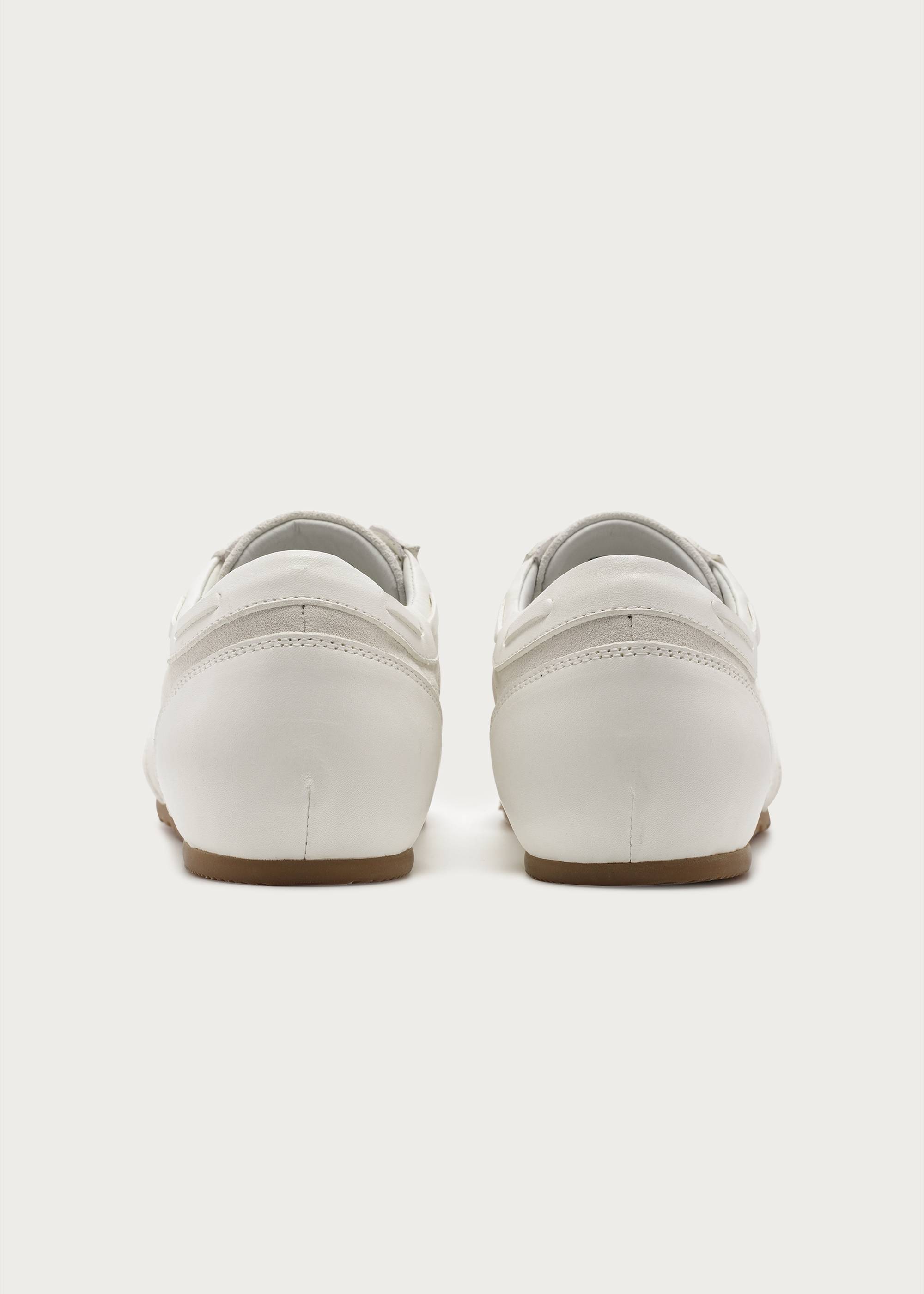 White leather sneakers styling angle