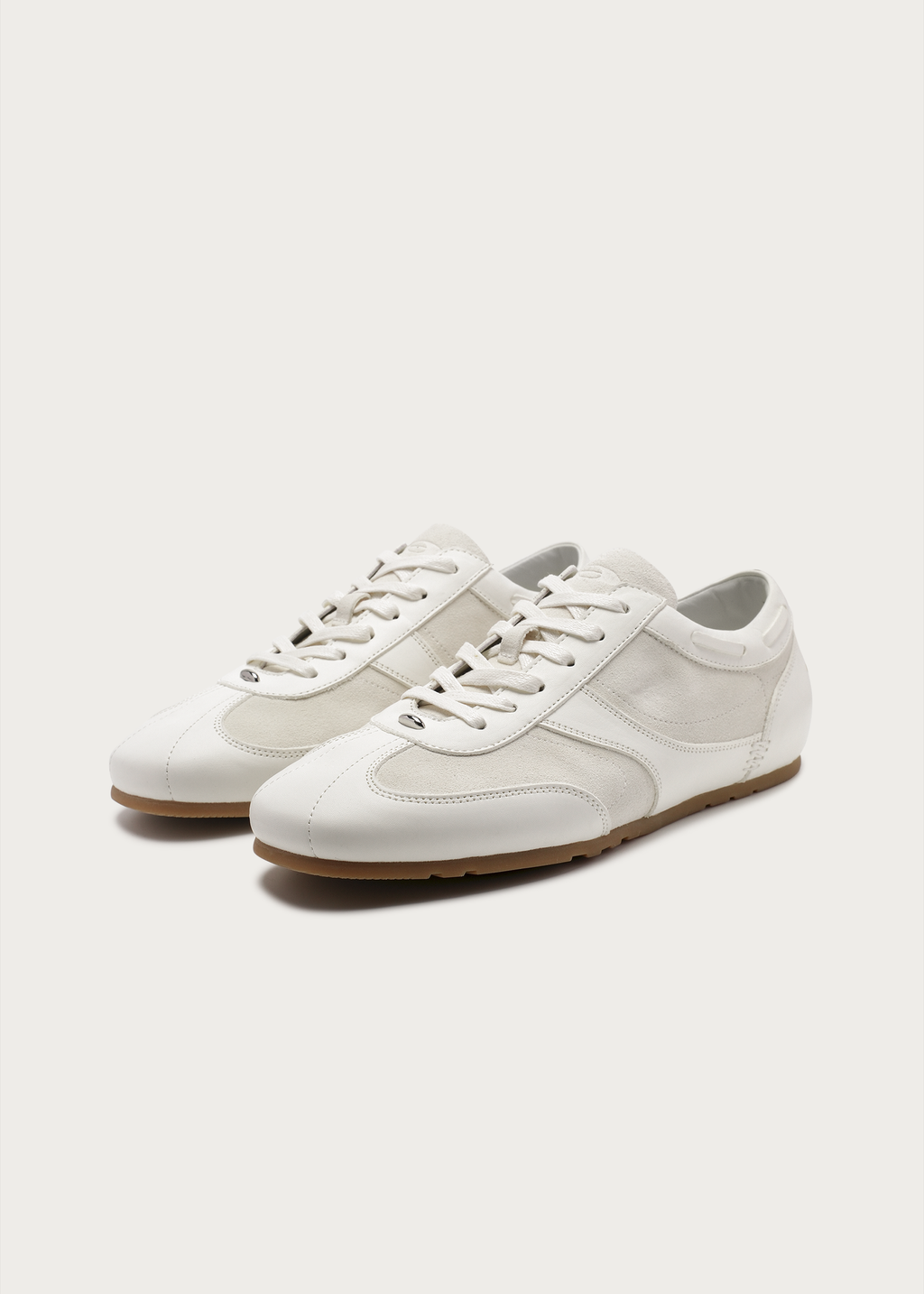 White metal-embellished leather sneakers front view