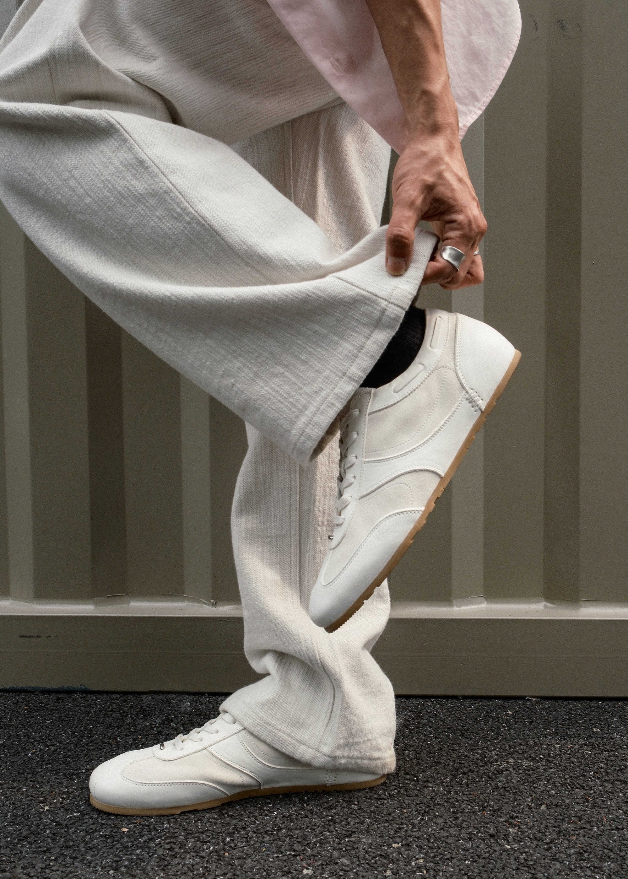Metal-embellished white sneakers side profile